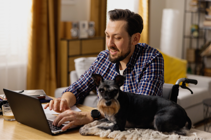 Happy remote client at home with dog